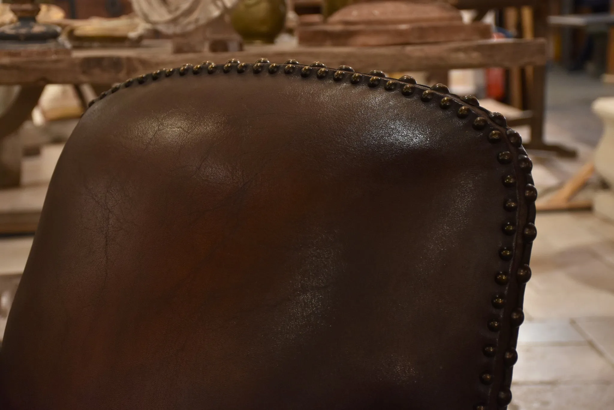 Dark French leather studded club chair - clouté