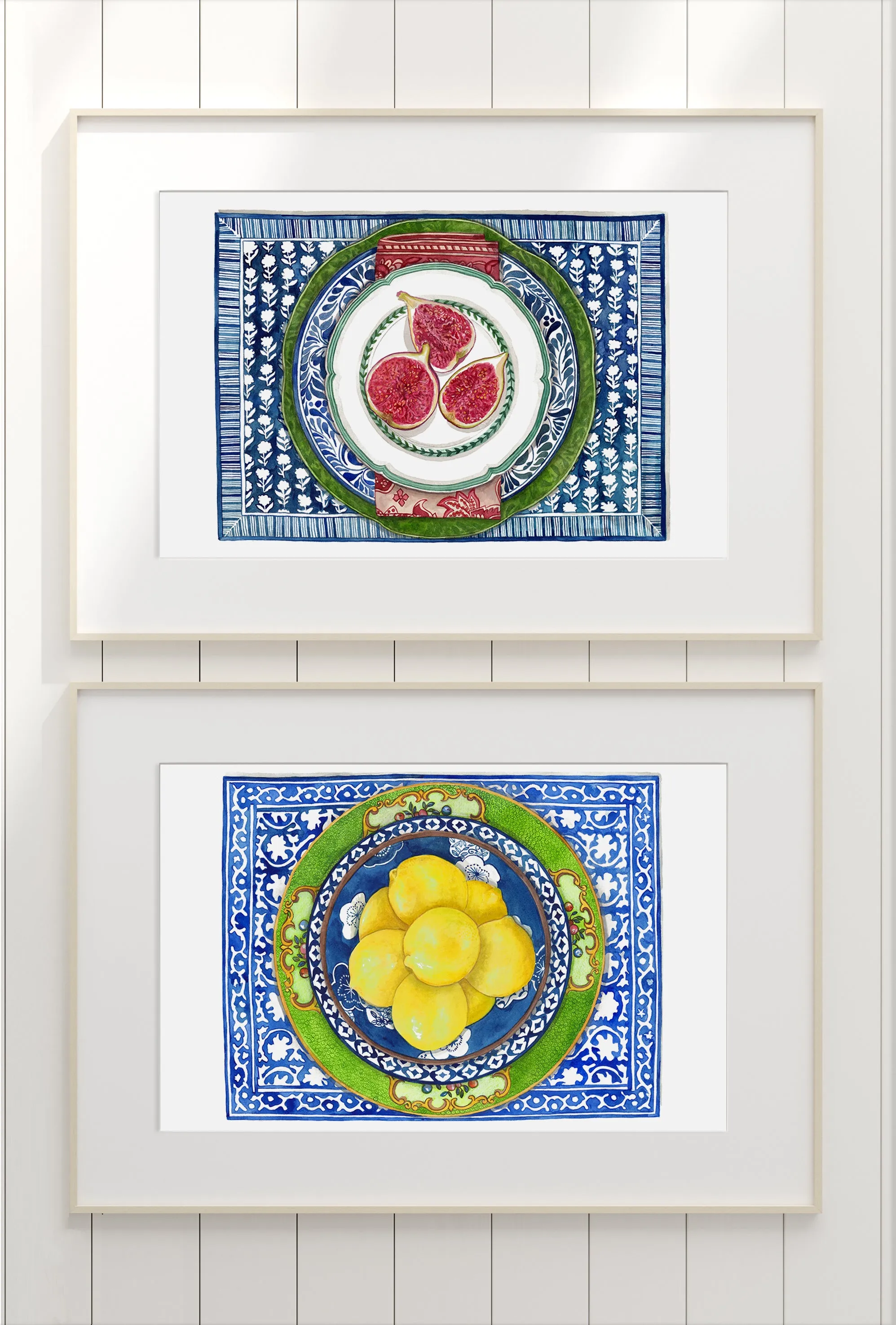 Print of figs on white and green plate with with patterned blue plate and table mat